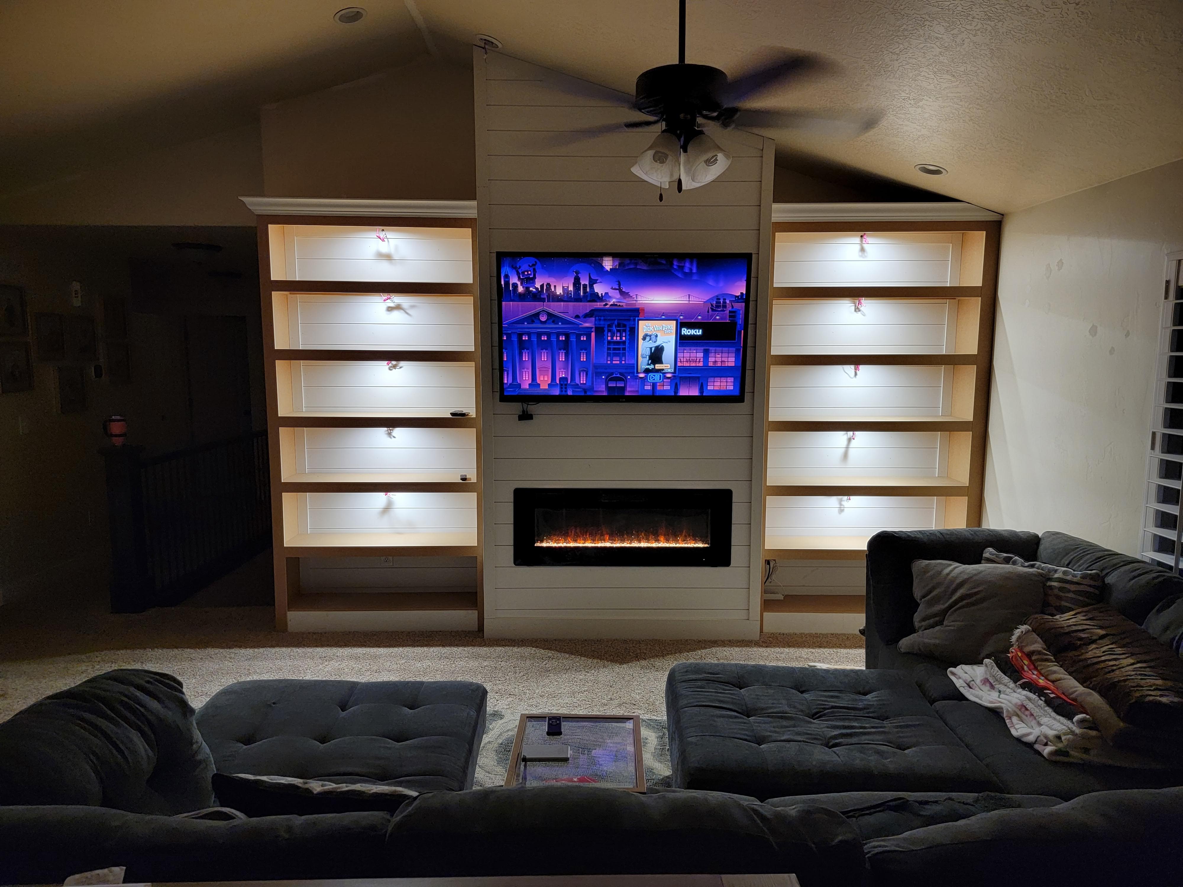 Cozy living room built-in with shiplap and LED lighting