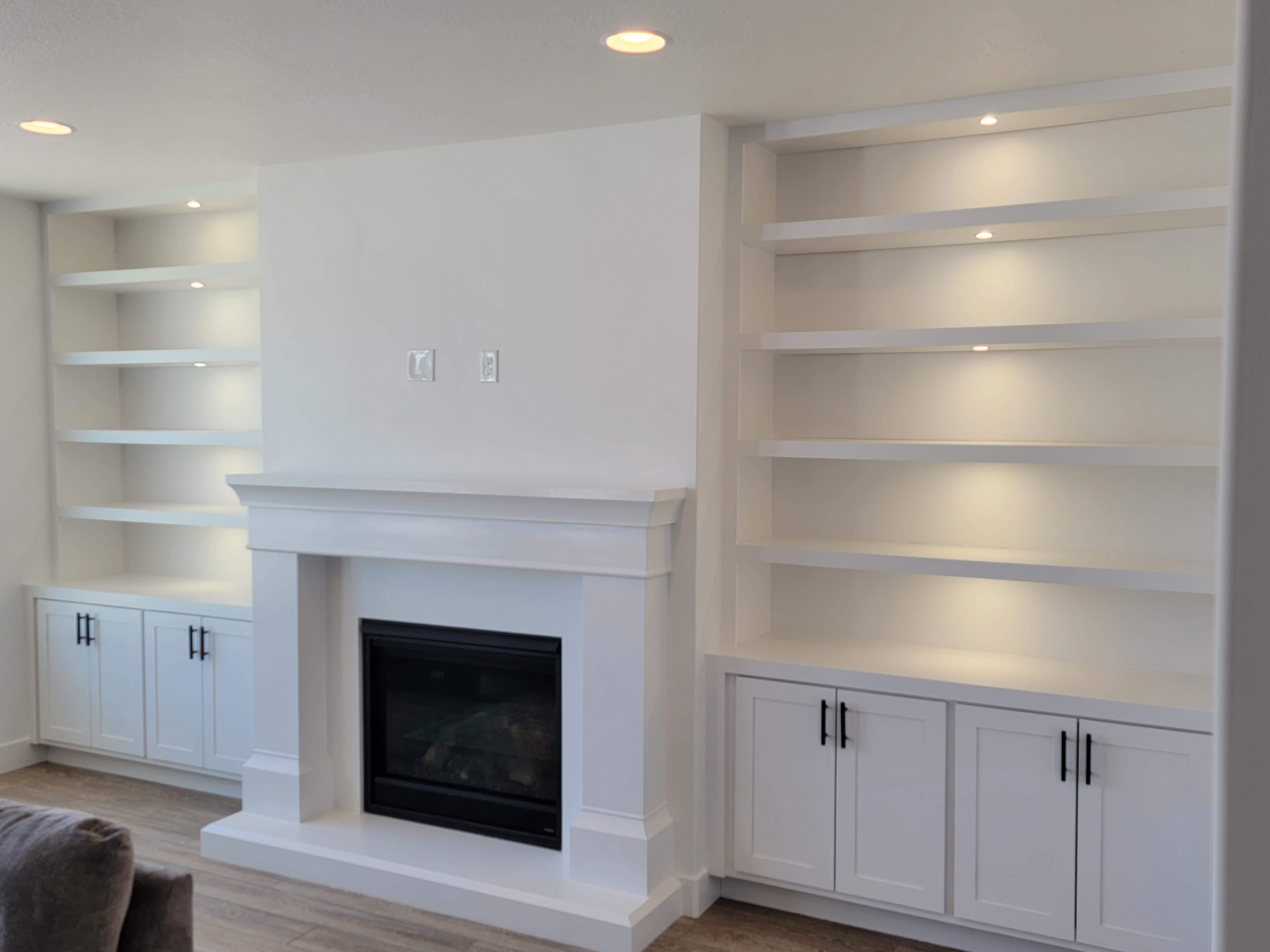 Built-in shelving flanking fireplace